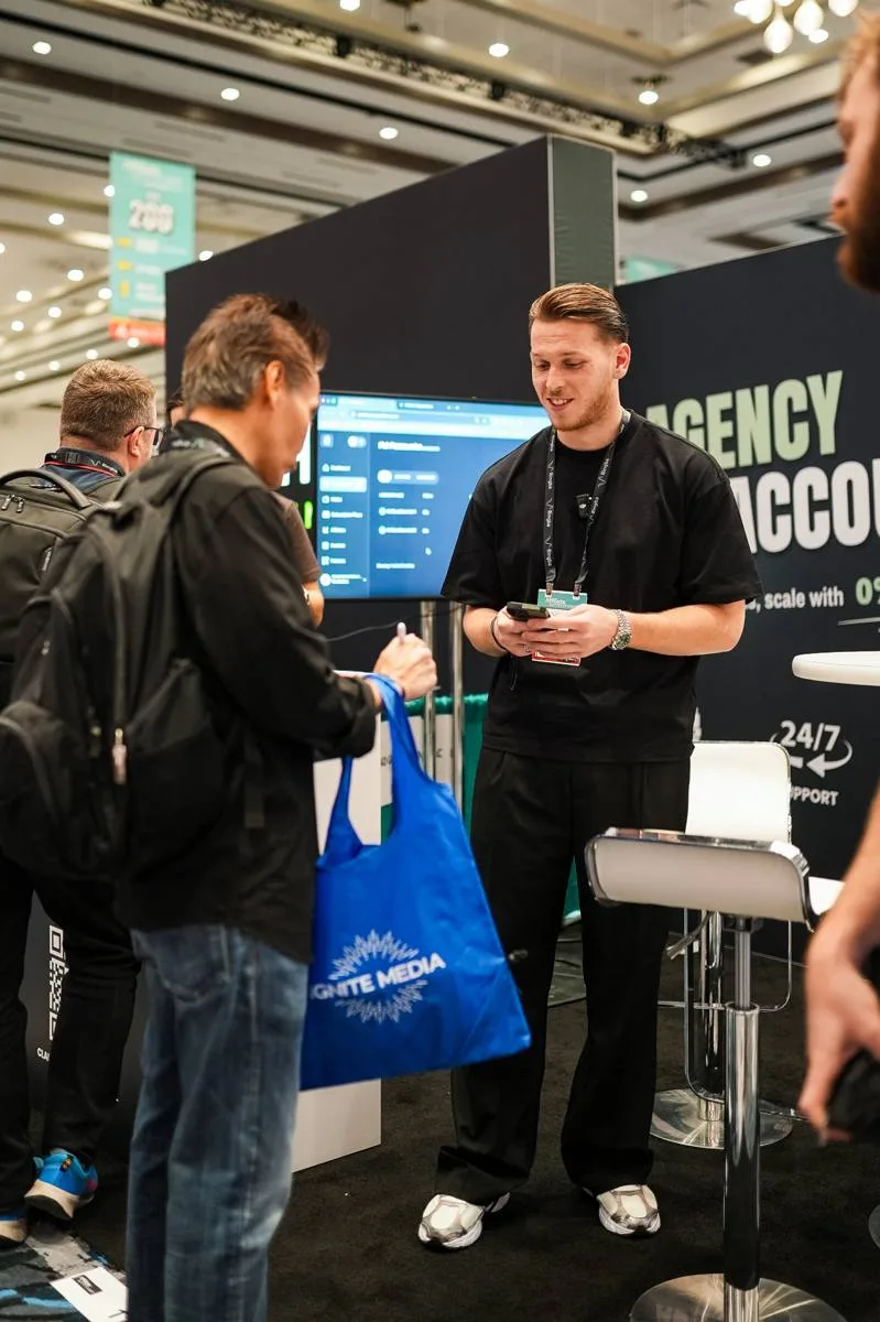 The AdGuardians team talking with advertisers at the booth